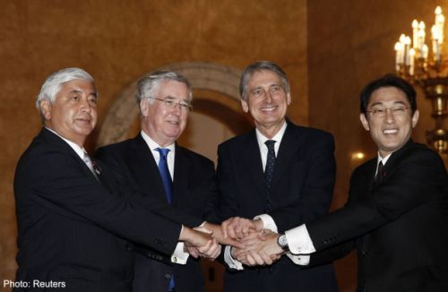 From left to right: Japanese Defence Minister Gen Nakatani, British Defence Secretary Michael Fallon, British Foreign Secretary Philip Hammond and Japanese Foreign Minister Fumio Kishida shake hands during a meeting at Lancaster House ahead of a meeting in London, January 21, 2015. 