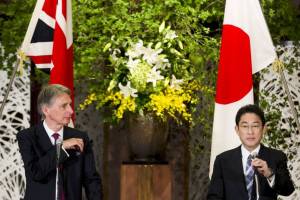 Foreign Minister Fumio Kishida and British Foreign Secretary Philip Hammond attend a news conference at Iikura House in Tokyo on Saturday. | REUTERS